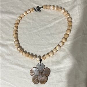 beaded necklace with flower pendant